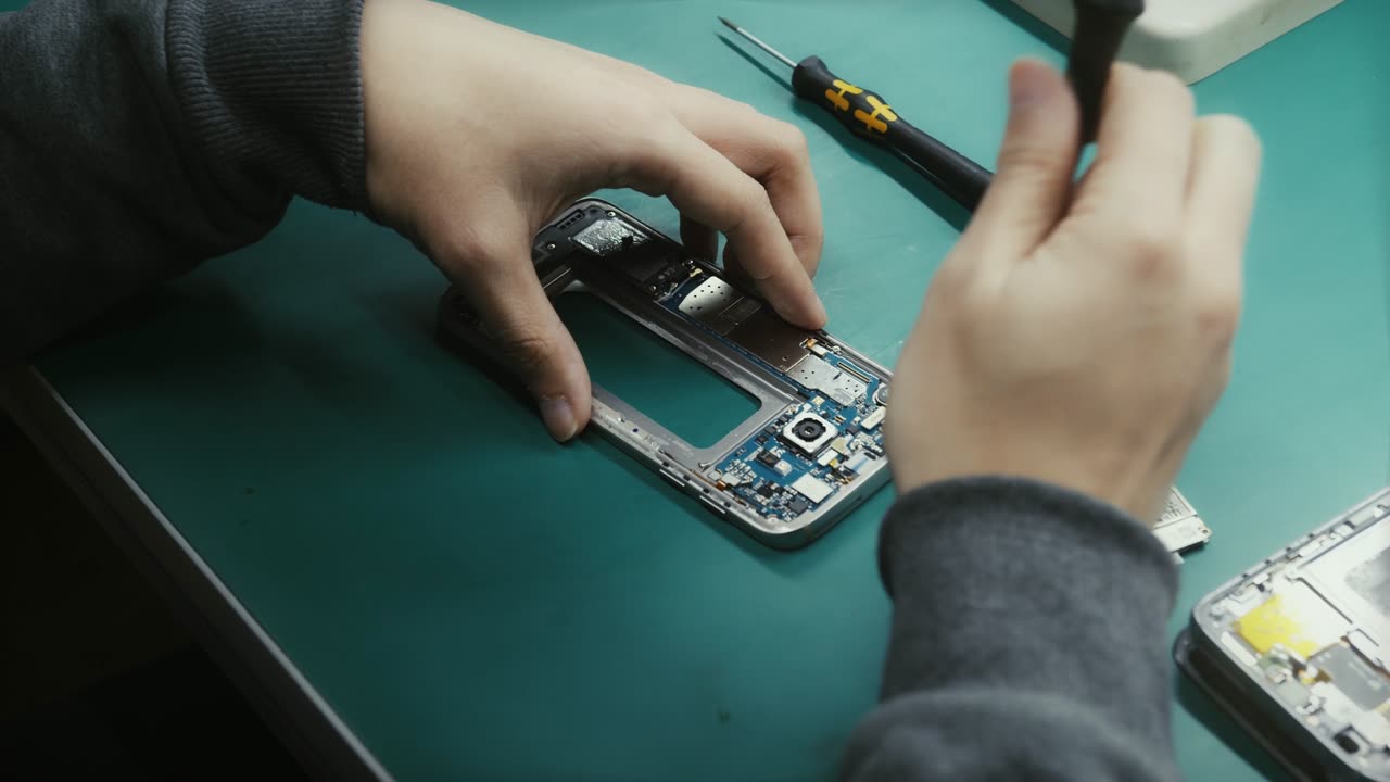 Phone being repaired at the workshop bench